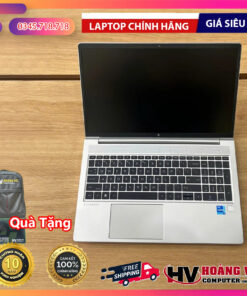 Silver HP laptop on wooden surface