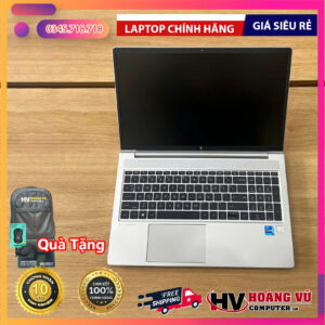 Silver HP laptop on wooden surface