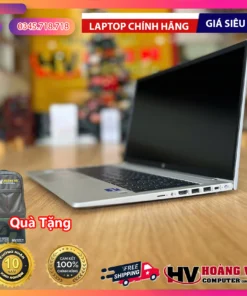 Silver HP laptop on wooden surface